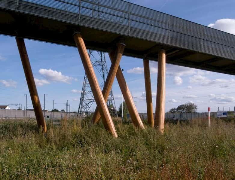 Column cluster with steel mesh guarding at deck level.